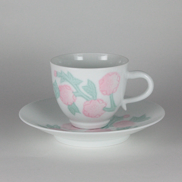 Manji Inoue white porcelain coffee bowl with green glaze and cherry blossom engraving