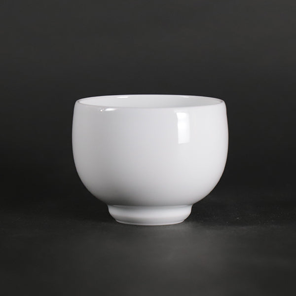 Manji Inoue white porcelain green glaze lily design sake cup