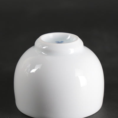 Manji Inoue white porcelain green glaze lily design sake cup